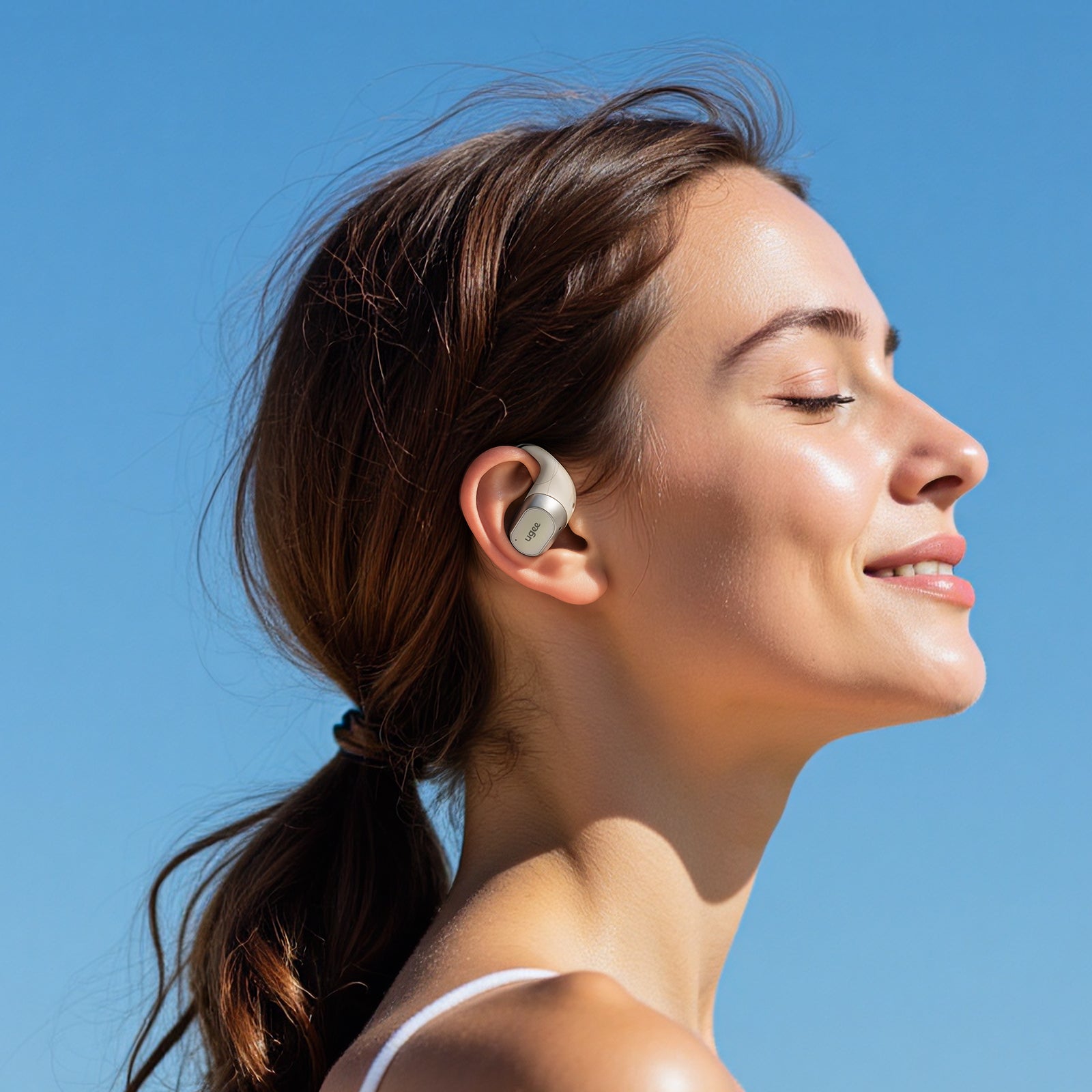 A woman is wearing FreSound Inspiration Open Earbuds, enjoying the impeccable, comfortable feeling when listening to music