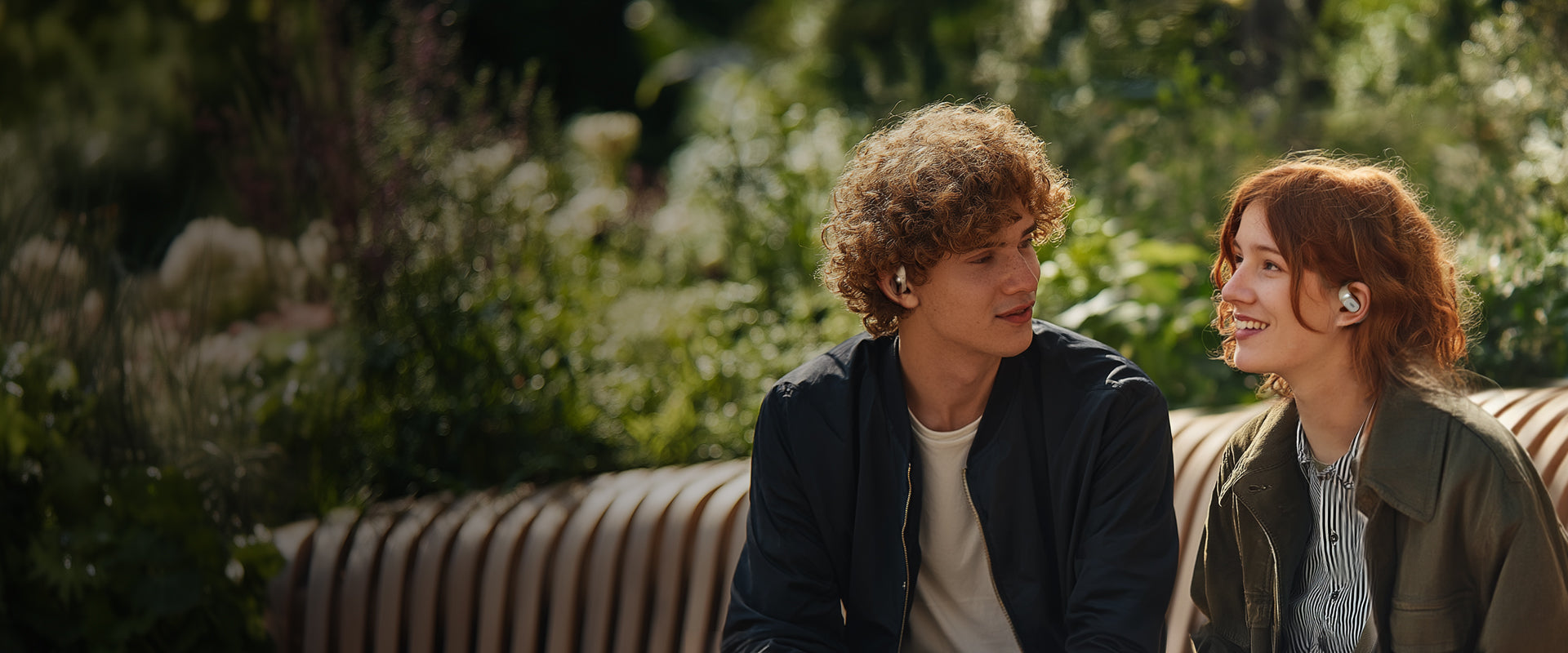 couple wear fresound open earbuds